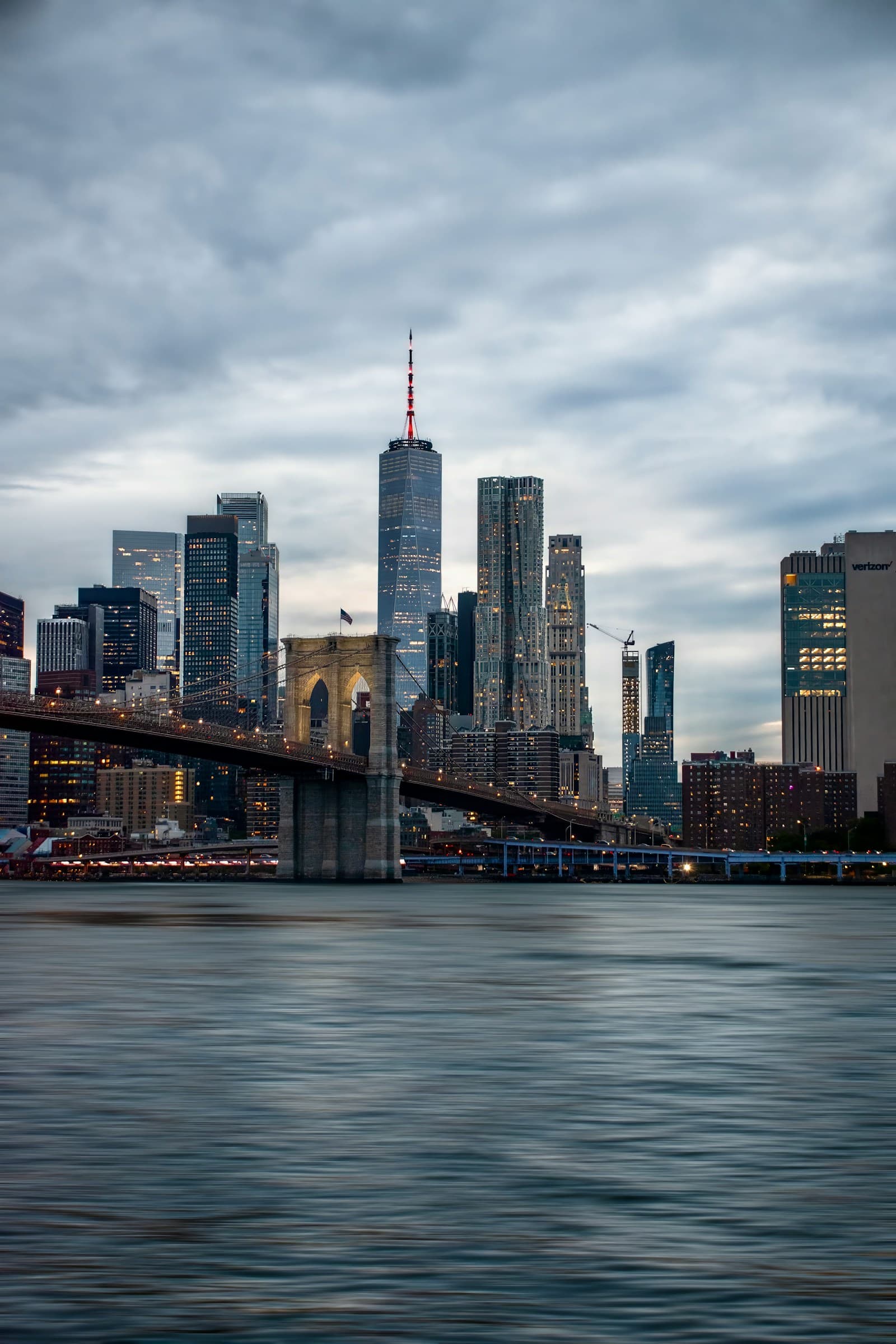 Lower Manhattan skyline and the Brooklyn Bridge at dusk